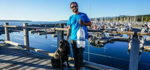 Jacob Banting with fur friend Jake handing out Clean Boating kits