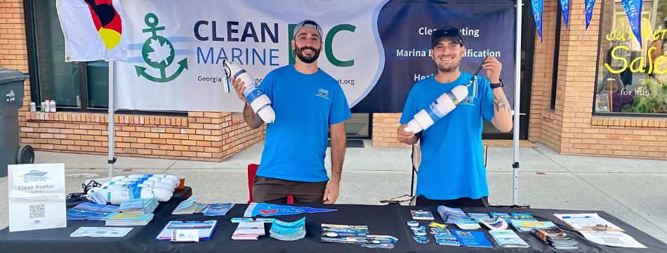 Jacob and volunteer doing boater surveys at the Blackberry festival in qathet